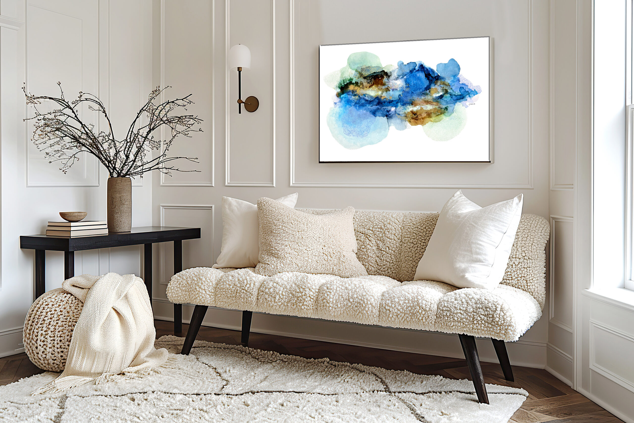 Classical interior design of modern home entryway, hall. Textured beige sofa, white pillows, and a soft knitted throw.